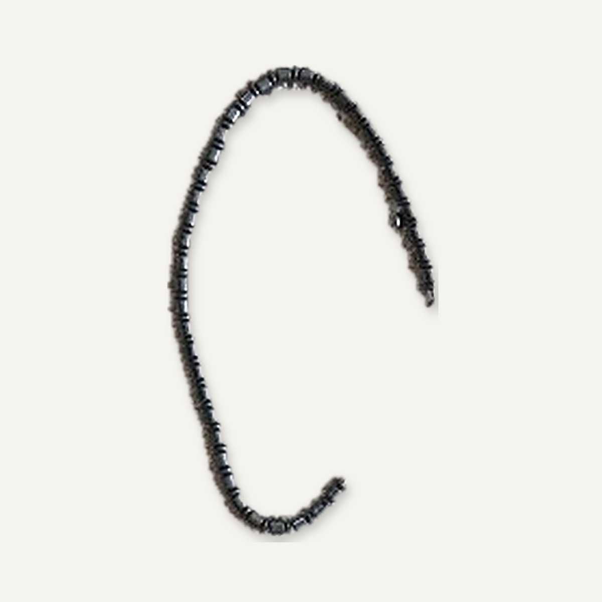 Close-up of the polished barrel beads and spacer rings
