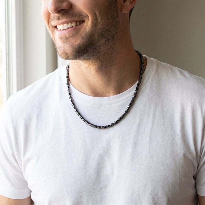 A man wearing the necklace