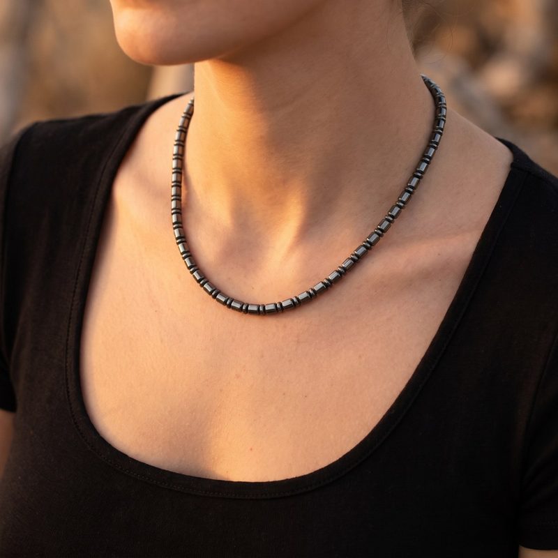 A woman wearing the necklace