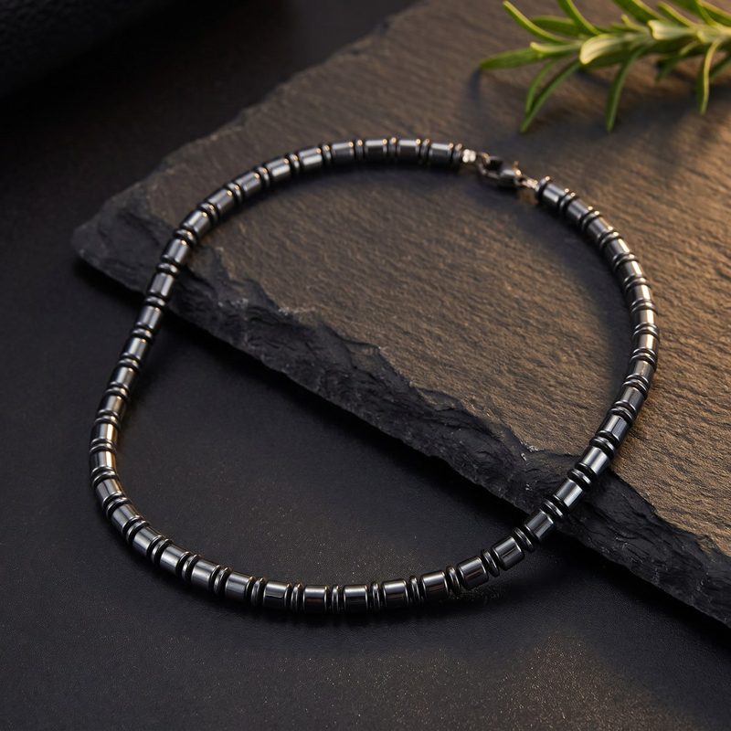 The necklace styled on dark slate